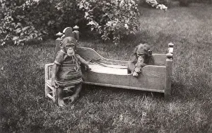 Two Baby Chimpanzees with childrens clothes and furniture