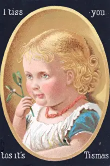 Baby girl with mistletoe on a Christmas card