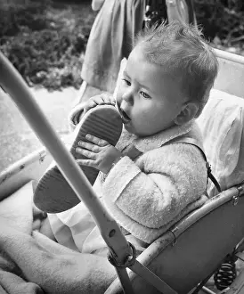 Baby holding shoe in Balham, SW London