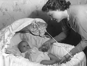 Baby in Moses Basket