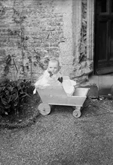 Resembles Prints: Baby in Wooden Cart
