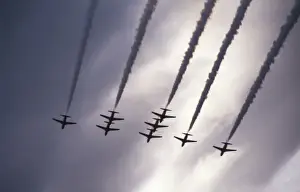 Skies Prints: BAe Systems Hawks RAF Red Arrows perform under dark skies
