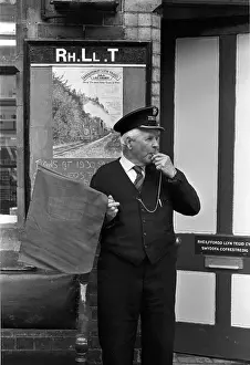 Bala Lake Railway guard Bob Davies at work on the platform