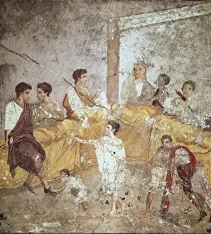 Banquet. Servants clean guests feet. Roman art