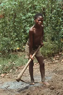 Hard Prints: Barefoot boy with mattock, Sierra Leone