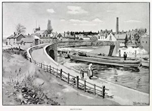 Brentford Collection: Barges pass beneath the bridge over the canal in Old Brentford, west London