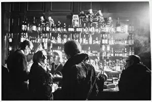 Barmaid in Smoky Pub