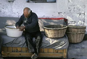 Artisan Collection: Basket maker, at work outside his house in Thassos, Greece