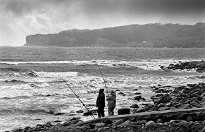 Images Dated 2nd July 2019: Two beach fishermen with their rods and line