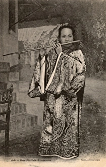 Annamite Gallery: A beautiful female Annamite flautist - Vietnam