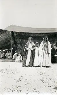 Gathering Prints: Two Bedouin men and a boy outside a tent, Middle East