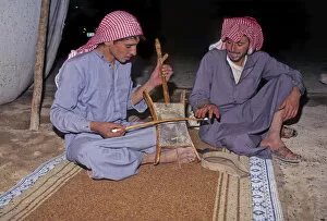 Syrian Collection: Bedouin men in tent in Syrian desert, one plays a rababah