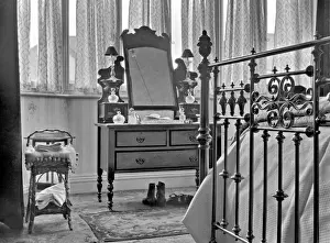 Bedroom interior with dressing table and bed