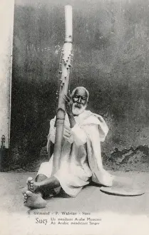 Plucking Prints: A begging musician in Suez, Egypt