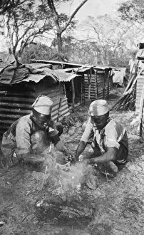 Belgian askaris preparing a meal, Lindi area, WW1