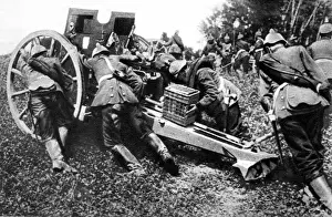 On the Belgian Frontier: German field guns being run forward to open fire
