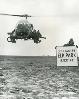 Hovers Prints: Bell Model 47G-3B hovers at Elk Park with eight men aboard