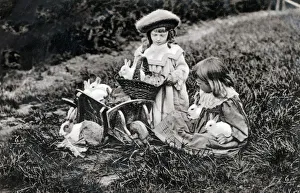 Images Dated 26th February 2019: A Big Family - Two young girls and a multitude of rabbits