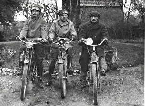 Three bikers on veteran motorcycles
