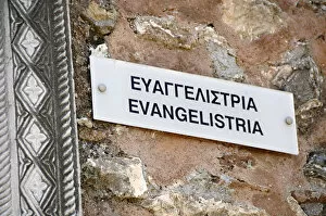 Peloponnese Collection: Bilingual poster on the wall of the Church of Evangelistria