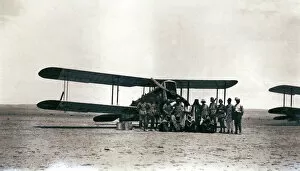 Biplane with crew and arabs in the desert, Iraq