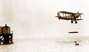 Dropping Prints: Biplane dropping a torpedo