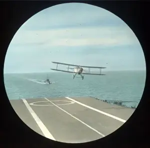 Biplane landing on an aircraft carrier