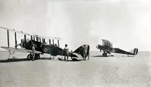 Bi Plane Collection: Two biplanes with resting crew, Iraq