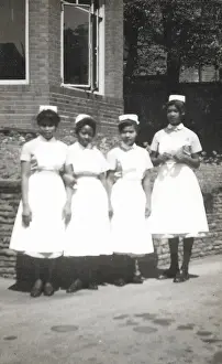 Student Prints: Four black nurses stand by the hospital wall in Nottingham