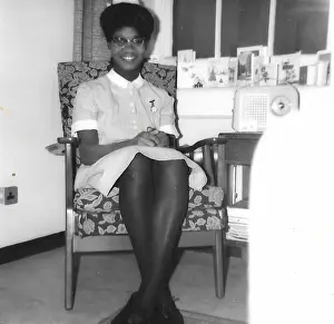 Black student nurse sitting in her room in Nottingham