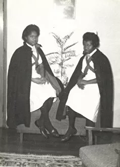 Capes Collection: Two black student nurses sitting by a plant in the Womens H