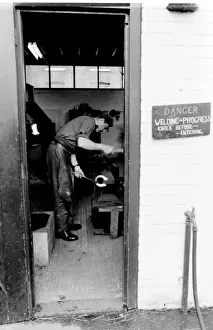 Blacksmith at work on a horseshoe