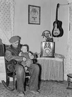 Crosby Prints: Blaze Gallagher and youngest son in home at Crosby, North Da
