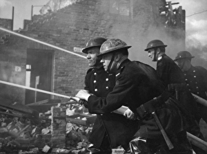 Fireman with hosepipe
