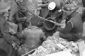 Casualties Gallery: Blitz in London -- rescue workers searching debris, WW2