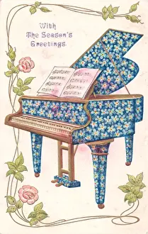 Blue flowers on a piano on a Christmas postcard