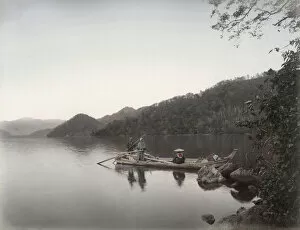 Boatmen on a tranquil lake, Japan