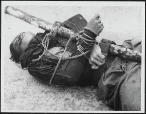 Stake Prints: Body of a Malayan Terrorist trussed to a stake