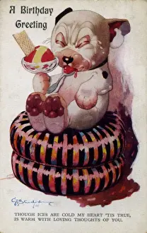 Bonzo on a cushion eating ice-cream