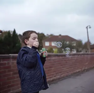 Boy Blowing Bubbles