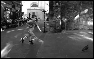 Avignon Gallery: Boy chasing a pigeon Avignon France