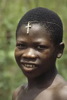 Sweating Prints: Boy with crucifix on his forehead, Sierra Leone