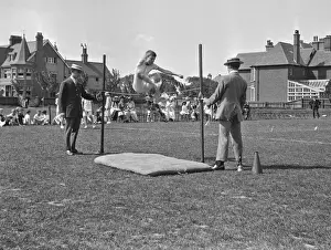 Loudspeaker Prints: Boy doing high jump at athletics event