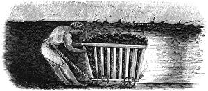 Boy dragging coal wagon with belt and chain in mine Boy dragging coal wagon with belt and chain in mine