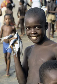 Boy with fishes, Sierra Leone