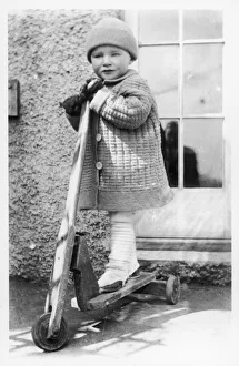 Boy on Toy Scooter