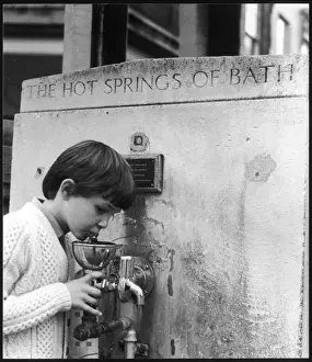 Boy at hot springs drinking fountain, Bath