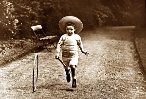 Hoop Prints: Boy playing with hoop and stick