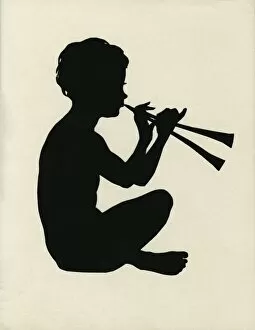 Boy playing pan pipes - Silhouette