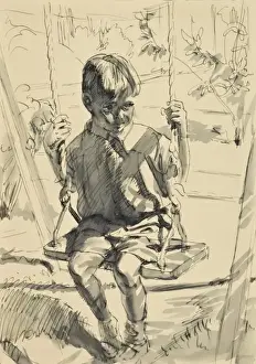 Boy playing on a swing
